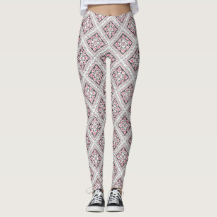 Kreuzstich. Ethnisch-rotes und schwarzes Dekor Leggings