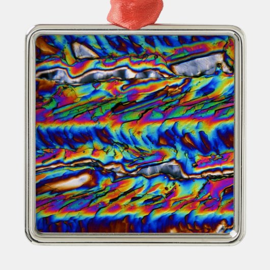 Kristalle des Zinkacetats unter dem Mikroskop Silbernes Ornament (Vorne)