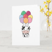Kuh fliegt mit farbenfrohen Balloons auf Karte (Gelbe Blume)