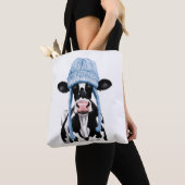 Kuh in einem Hut. Tasche (Von Nahem)