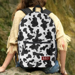 Kuh Print Western Animal Spots Muster Mit Monogram Bedruckter Rucksack<br><div class="desc">Egal, ob Sie ein Ränger, ein Cowgirl oder nur jemand sind, der den alten amerikanischen Westen und die Farmen Lieben, diese niedlichen gepunkteten Schwarz-Weiß-Kuh-Printbackpacks sind perfekt für Ihren Western Stil. Die Tiergrafik ist gemacht, um wie das Fell / Haar von Rindern aussehen. Dieses schöne, originelle Rinderdesign wird Ihnen den rustikalen...</div>