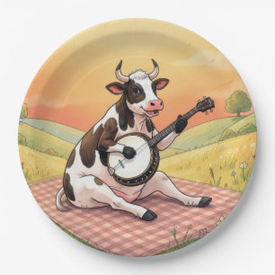 Kuh spielt Banjo auf einer Decke Pappteller