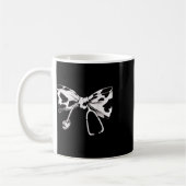 Kuhdruckbügel und Stethoskop-Abschluss Kaffeetasse (Links)