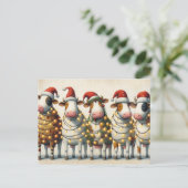 Kühe mit Weihnachtslicht der Weihnachtsmannmütze Feiertagspostkarte (Stehend Vorderseite)