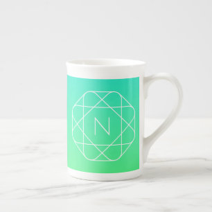 Kühles geometrisches Monogramm Blau und Limetten Porzellantasse