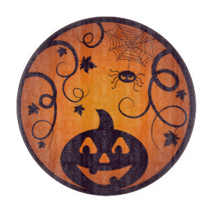 Kürbisgesicht und Spinne der Kürbislaterne Hallowe Schneidebrett
