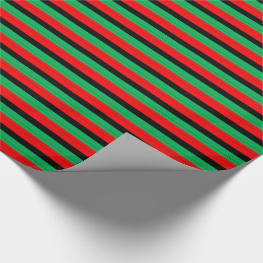 Kwanzaa färbt rotes schwarzes grünes geschenkpapier (Ecke)