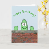 Lächelnd grüner Kaktus-Charakter, der über einer W Karte (Gelbe Blume)