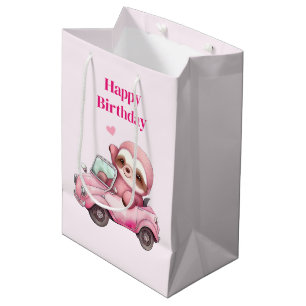 Lächelnd rosafarbener Faultier, der zum Geburtstag Mittlere Geschenktüte