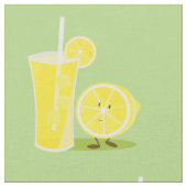 Lächelnde Zitrone und ein Glas Limonade Stoff (Nahaufnahme)