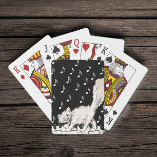 Lächelnde zwinkernde flauschige weiße Katze am Kla Spielkarten