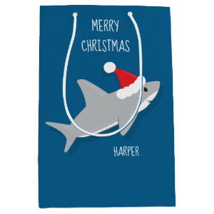 Lächelnder Cartoon Shark in Weihnachtsmannmütze  Mittlere Geschenktüte