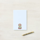 Lächelndes Fliegensitzen mit Kreuzleder Post-it Klebezettel (Auf Schreibtisch)