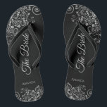 Lacy Silver on Black Elegante The Bride Wedding Badesandalen<br><div class="desc">Tanzen Sie die Nacht mit diesen schönen Hochzeitsflip-Flops. Sie sind für die Braut konzipiert und zeichnen sich durch ein schlichtes und elegantes Design aus, das auf einem klassischen schwarzen Hintergrund mit grauen Schriftzeichen und extravaganten, silbergrauen Zierbögen und Wirbel versehen ist. Eine schöne Art, extravagant und angemessen bleibe, während Sie Ihren...</div>