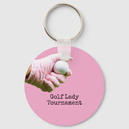 Lady golfer is holding golf ball on pinkbackground schlüsselanhänger