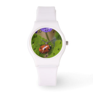 Ladybug über süße Violettsorten-Blume Armbanduhr