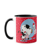 Landkühe mit roten Weihnachtsmannmützen