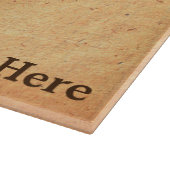 Lärchenzweig auf altem Papier Schneidebrett (Ecke)