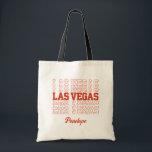 Las Vegas Bachelorette Bridesmaid Tasche<br><div class="desc">Machen Sie sich mit dieser farblich anpassbaren Begrüßungstasche auf ein unvergessliches Hochzeitserlebnis in Las Vegas vorbereitet! Es ist die perfekte Geschenkidee, die die Gäste gewollt werden, um behalten. Diese schlanke und praktische Tasche enthält neben den Worten "Las Vegas" auch Ihre Namen und Ihr Datum. Die Farbe ist im Zazzle-Editor vollständig...</div>