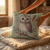 Launenhafte botanische Illustration einer Eule im  Kissen