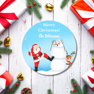 Launiger Weihnachtsmann spielt Golf, Schneemann un Runder Aufkleber