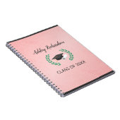 Laurel und Cap im rosa Hintergrund Notizblock (Rechte Seite)