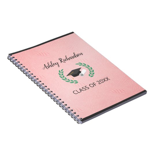 Laurel und Cap im rosa Hintergrund Notizblock (Rechte Seite)