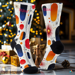 Lebendige Feiertage mit roten, blauen und goldenen Socken