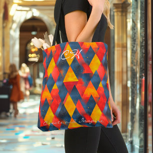 Lebendige geometrische Dreiecke in Rot, Gelb, Blau Tasche