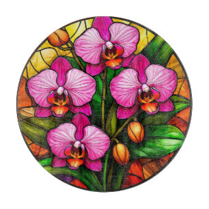 Lebendige rosa Orchideen und grüne Blätter Schneidebrett