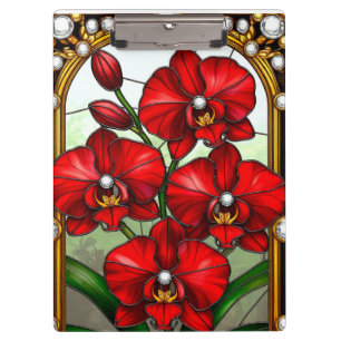 Lebendige rote Orchideen in ornamentaler goldener Klemmbrett