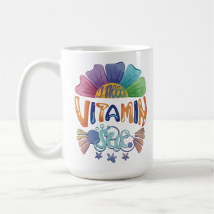 Lebhafte Regenbogenhandschrift: Ich brauche Vitami Kaffeetasse