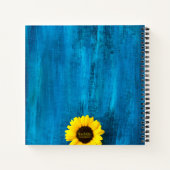 Lebhafte Sonnenblume und Monogramm auf blauem Hint Notizblock (Rückseite)