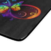 Lebhafte Unendlichkeit mit Regenbogenschmetterling Schneidebrett (Ecke)