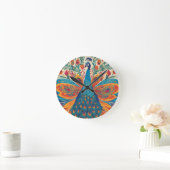 "Lebhafter Pfau im mexikanischen Folkkunststil Runde Wanduhr (Zuhause)