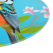 Lebhafter Songbird auf einem blühenden Zweig Schneidebrett (Ecke)