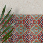 Lebhaftes ethnisch verzweigtes geometrisches Muste Fliese<br><div class="desc">Diese Keramik-Kachel zeichnet sich durch ein faszinierendes symmetrisches Muster aus, das traditionelle und ethnische Einflüsse kombiniert. Die geometrischen Formen, darunter Diamanten und Zickzacklinien, schaffen einen dynamischen visuellen Rhythmus, der gleichzeitig einnehmend und harmonisch ist. Die Farbpalette ist reich und erdig, mit aquamarinen, verbrannten Orangen, tiefroten und lila Farbtönen, die von zarten...</div>