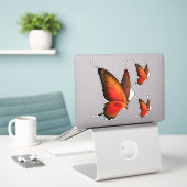 Lebhaftes Orange Butterfly-Set mit kundenspezifisc Aufkleber (Laptop auf Schreibtisch)