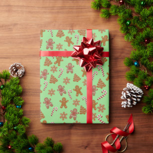 Lebkuchen und Zuckerstangen auf grünem Hintergrund Geschenkpapier