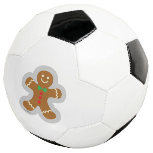 Lebkuchenmann, der den Engel im Schnee bildet Fußball