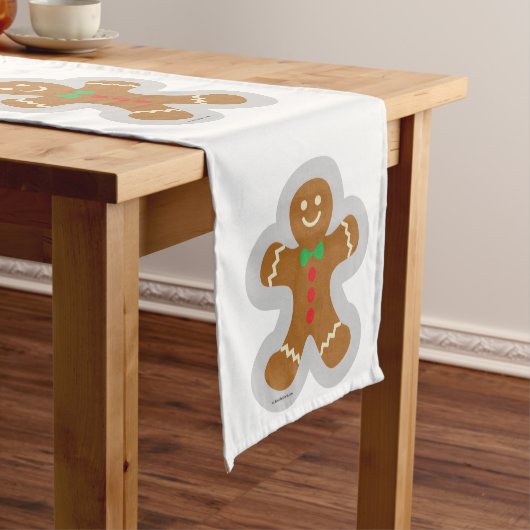 Lebkuchenmann, der den Engel im Schnee bildet Mittelgroßer Tischläufer (Beispiel)