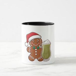 Lebkuchenmann hält Matcha-Getränk Weihnachten Tasse