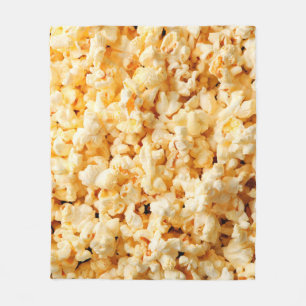 Leckeres Popcorn auf dem ganzen Hintergrund. Essen Fleecedecke