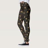 Leggings aus goldschwarzem Gewand (Links)