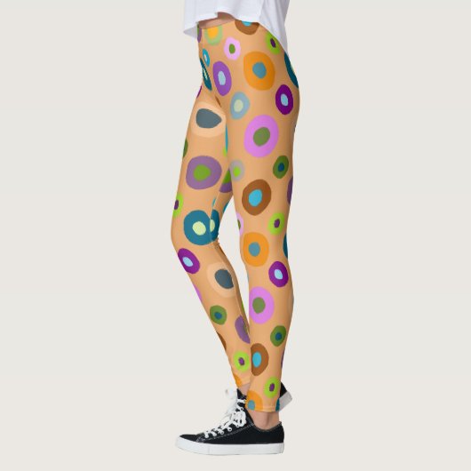 Leggings in farbenfrohen Punkten auf orange (Links)
