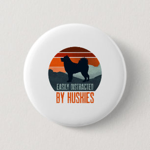 Leicht abgelenkt von Huskies, die laufen Button