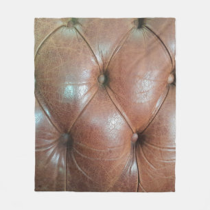 Leicht auf brauner Ledersofa-Oberfläche, textureab Fleecedecke