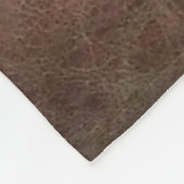 Leicht auf brauner Ledersofa-Oberfläche, textureab Fleecedecke (Ecke)