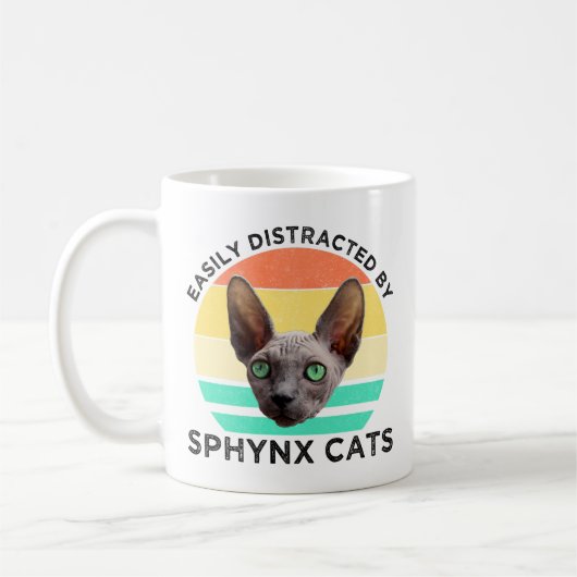 Leicht von Sphynxkatzen abgelenkt Kaffeetasse (Links)
