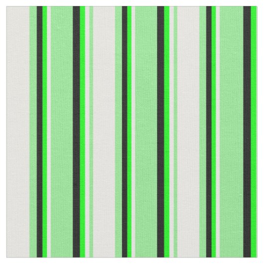 Leichte, grüne Creme, Limone und schwarze Streifen Stoff (Nahaufnahme)
